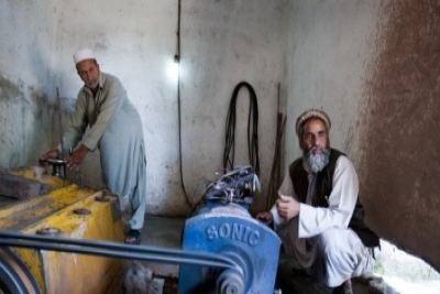 The micro-hydro power generates electricity for the village from canal water, allowing the residents the opportunity to use things such as mobile phone chargers, washing machines and light globes. Graham Crouch/World Bank